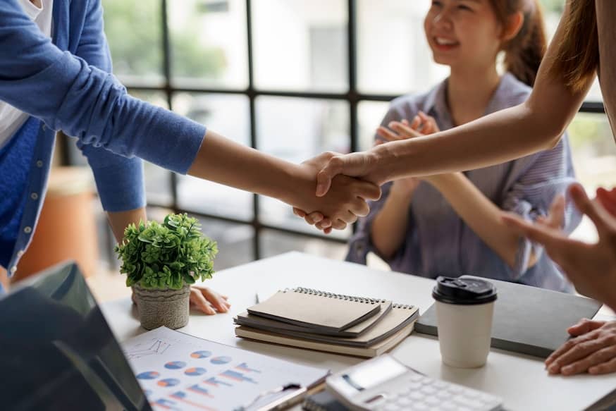People shaking hands after a successful referral